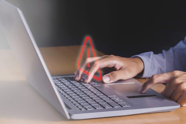 person-typing-laptop-with-red-arrow-screen